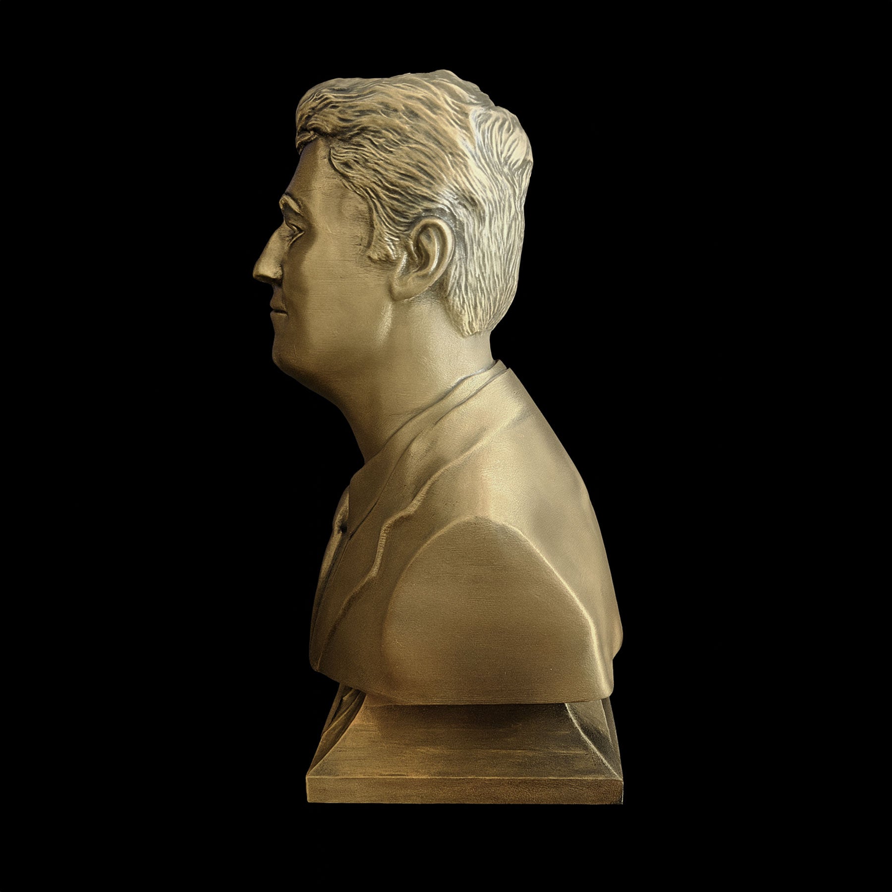 Charlie Kirk bust side profile — golden metallic surface with hand-applied texture