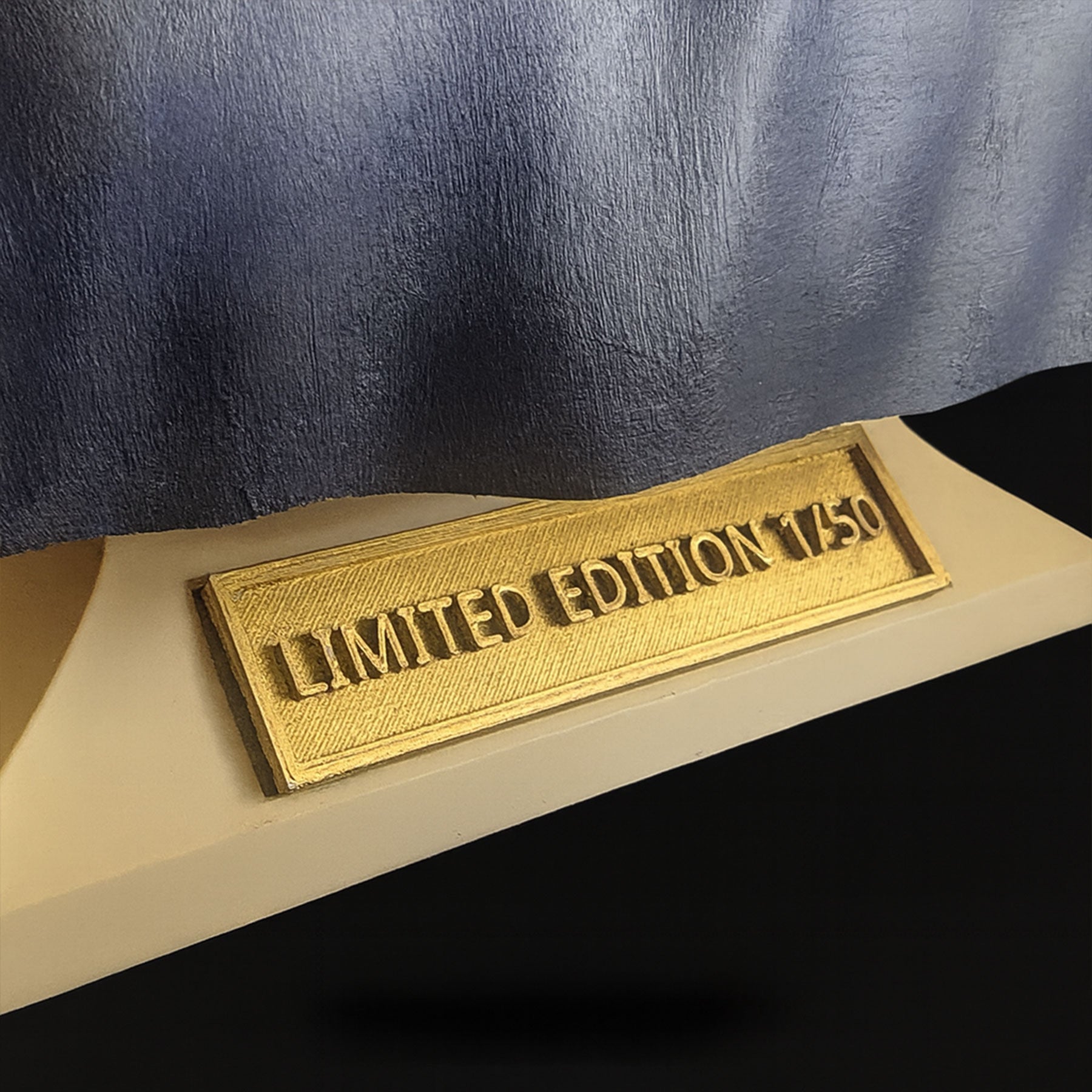 Charlie Kirk bust nameplate engraved plaque close-up — gold metallic finish