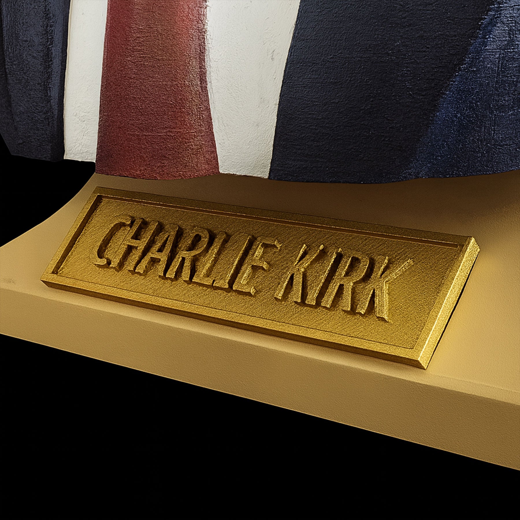 Charlie Kirk bust close-up of base and gold nameplate with signature engraving